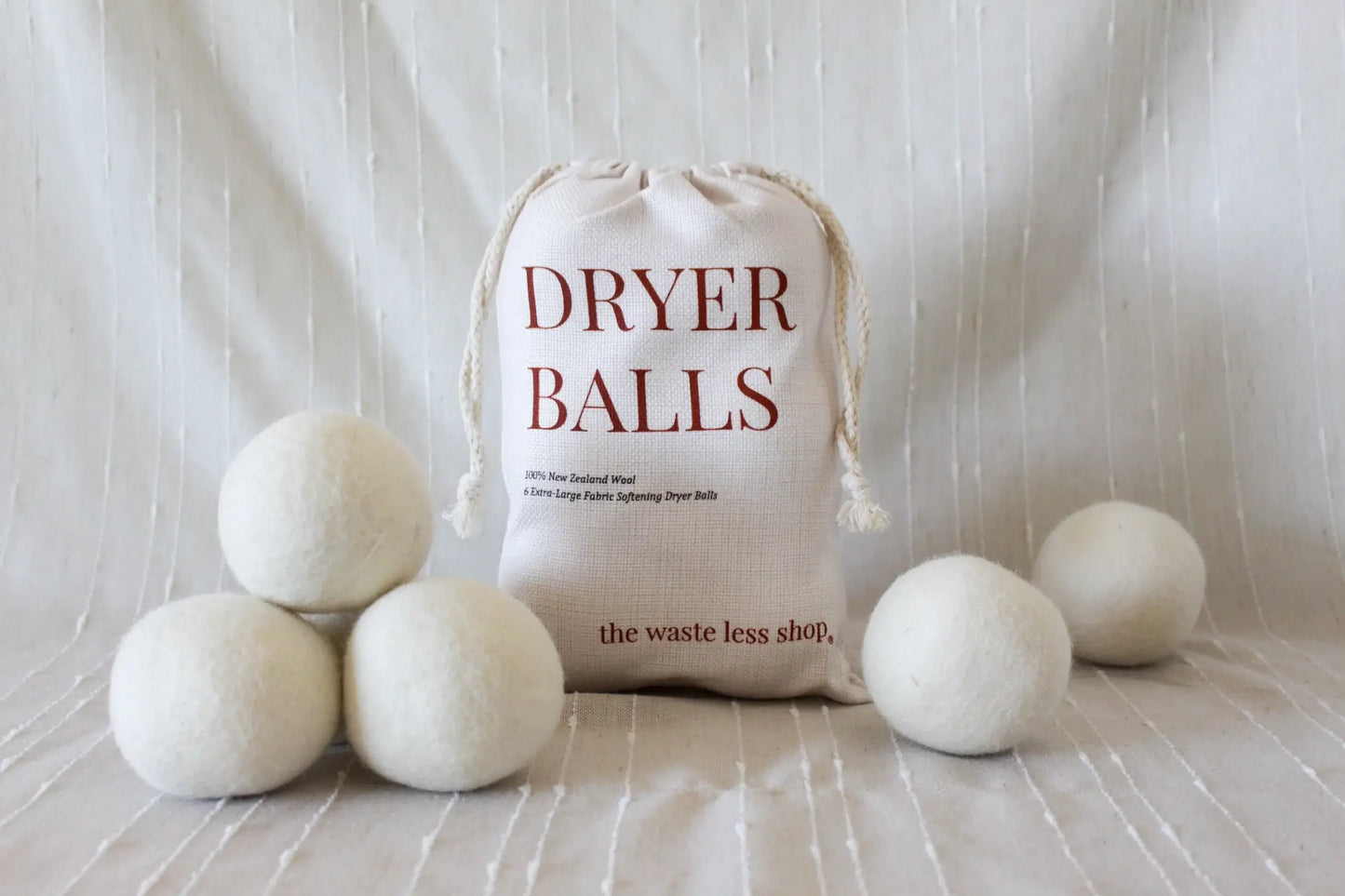 Eco-friendly wool dryer balls by The Waste Less Shop, perfect for sustainable laundry care.