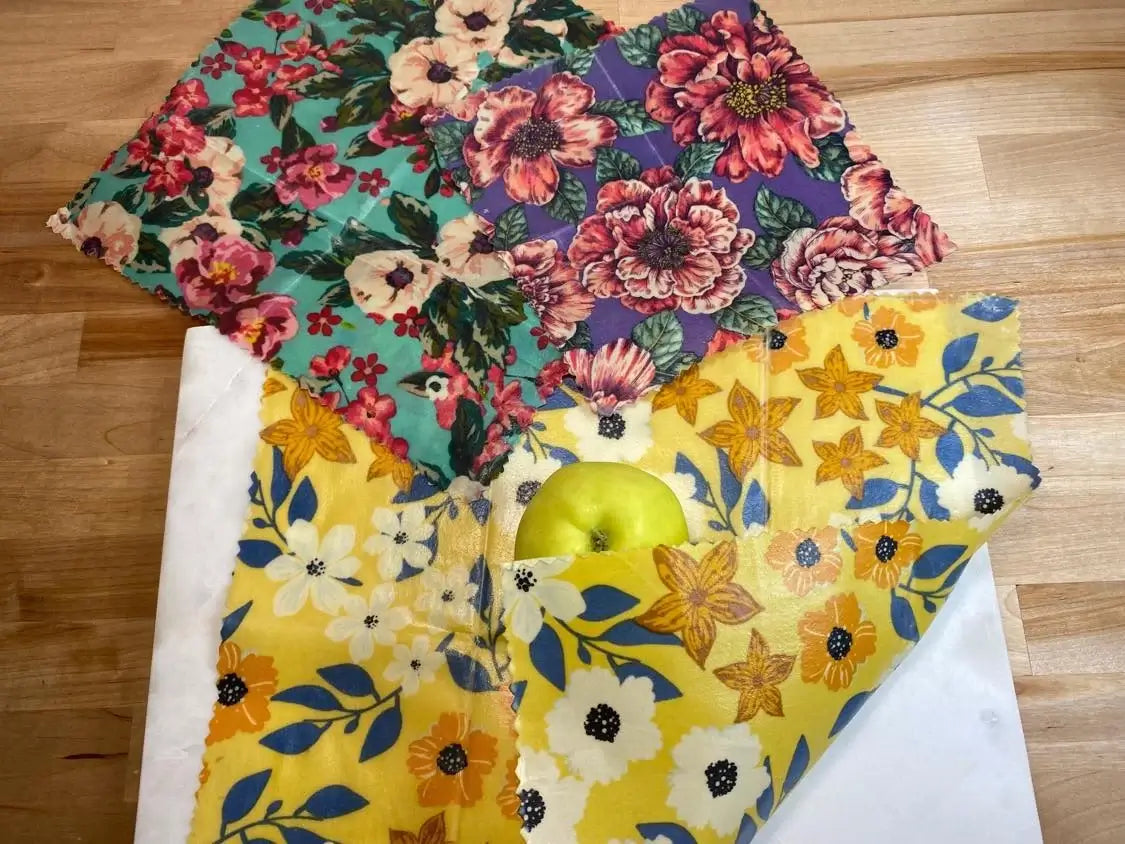 3 pack of colorful beeswax food wraps featuring floral patterns, ideal for eco-friendly food storage.