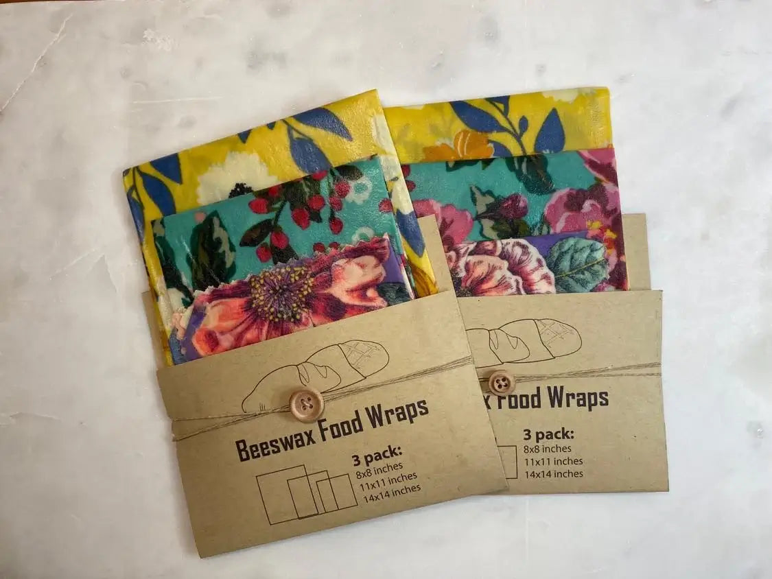 3 pack of eco-friendly beeswax food wraps in assorted patterns, featuring sizes 8x8, 11x11, and 14x14 inches.