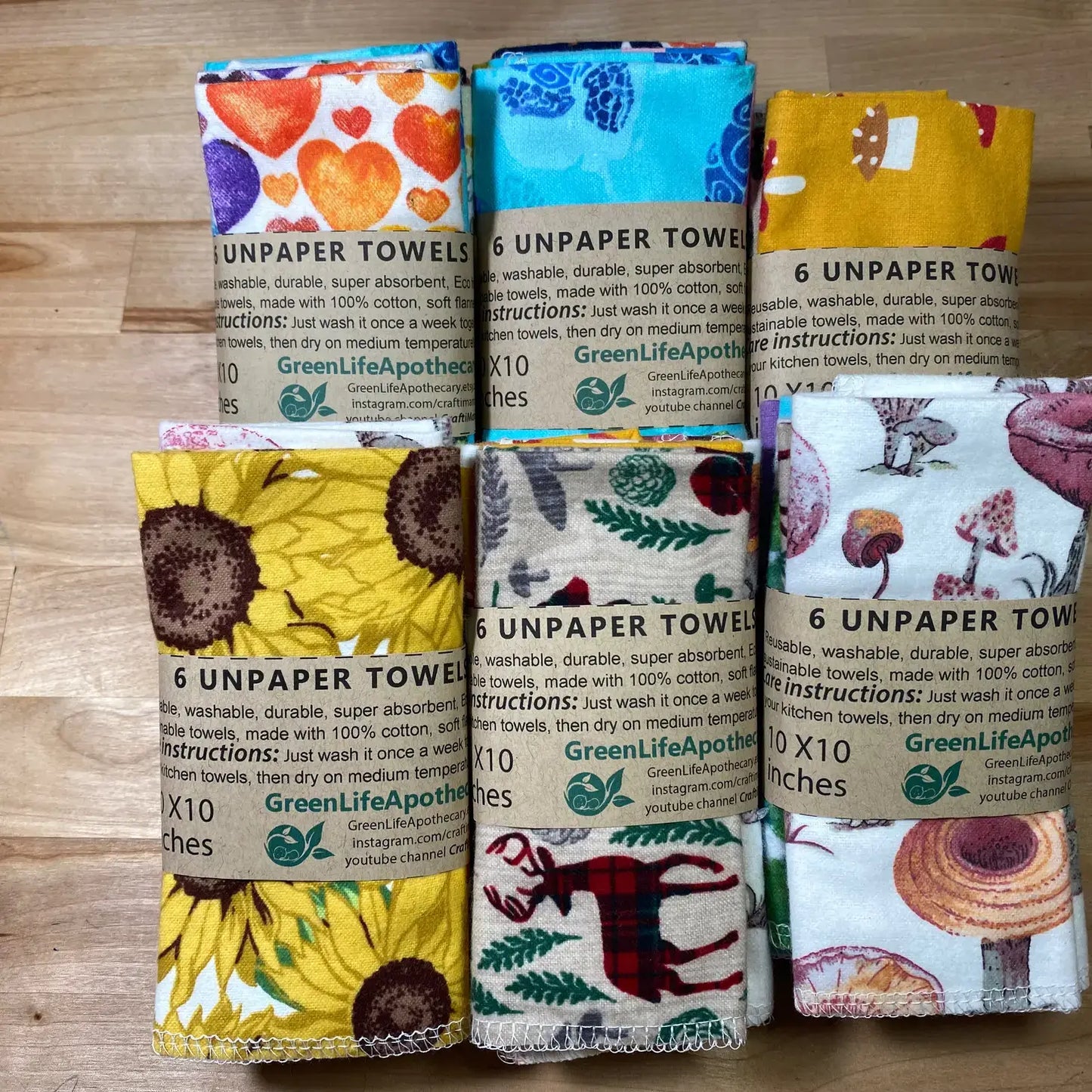 12 pack of eco-friendly Unpaper Towels with colorful designs, 10x10 inches, by GreenLife Apothecary, reusable and absorbent.